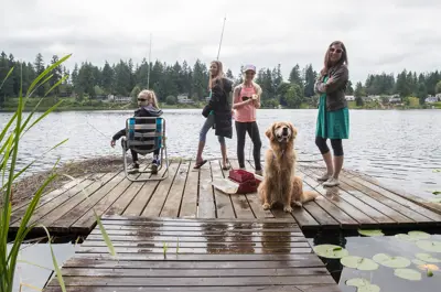 kids fishing on a dock