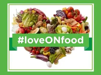 A variety of local foods put together to make a heart shape. A text overlay reads &quot;#loveONfood&quot;