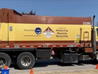 Miller Waste truck picking up waste in Bobcaygeon