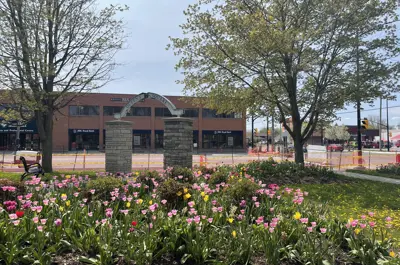 Queens' square gardens with fencing to fence off for redevelopment
