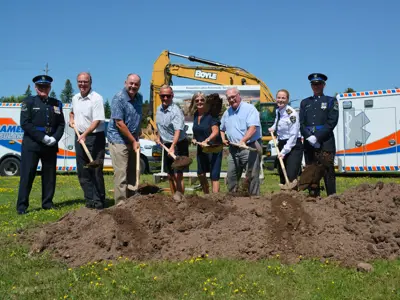 Councillors shoveling at groundbreaking ceremony