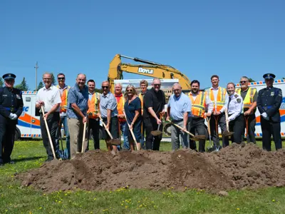 Ceremony Attendees posing with shovels