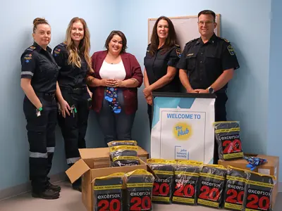 Kawartha Lakes Paramedics delivering sock donation to The Hub